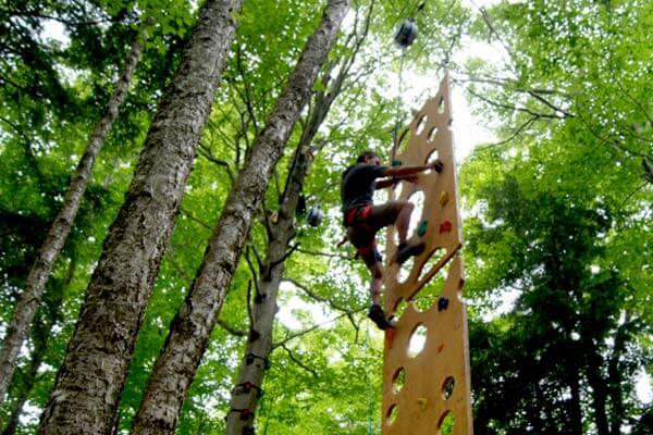 Climber on vertical challenge obstacle