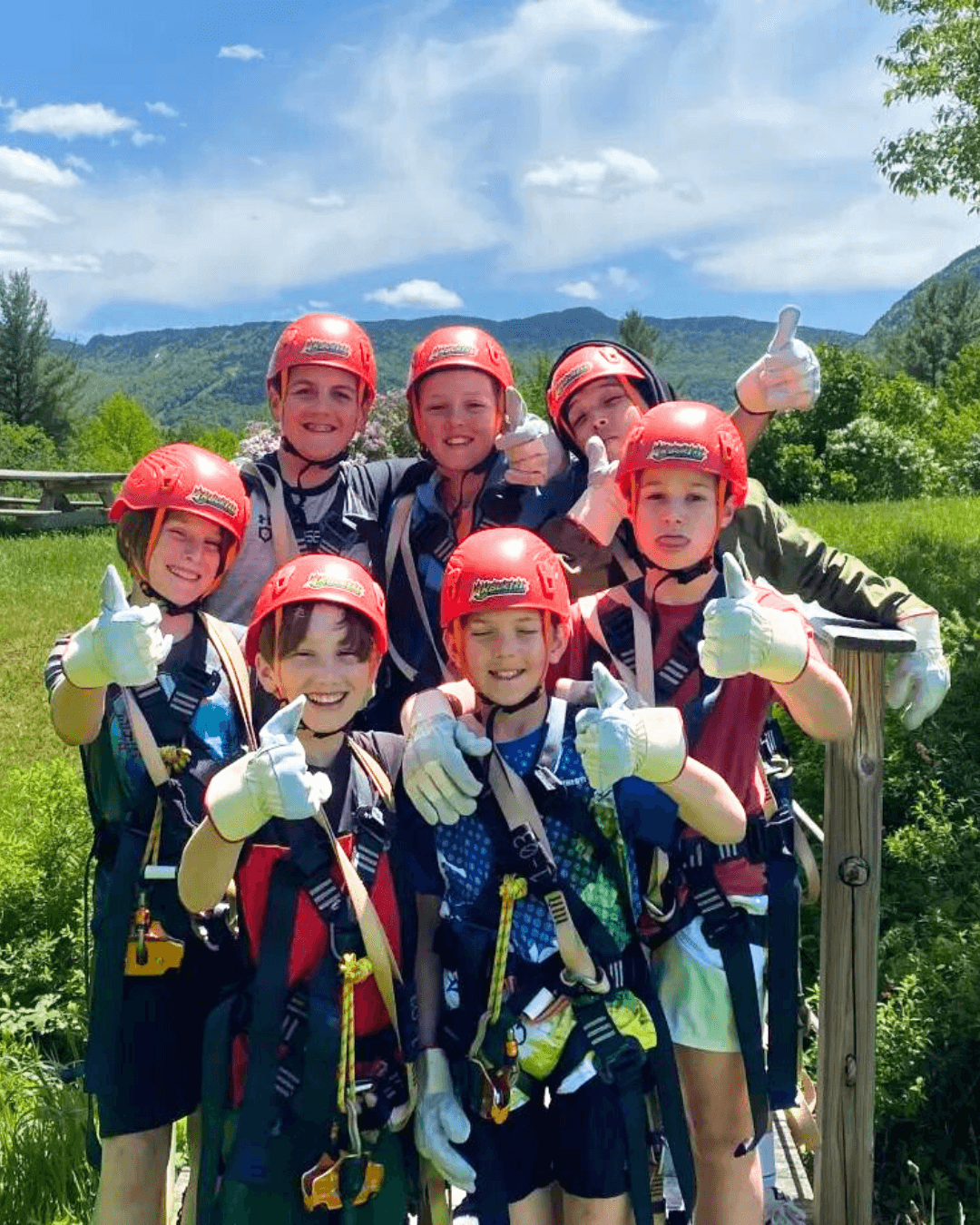 Family navigating treetop obstacle course